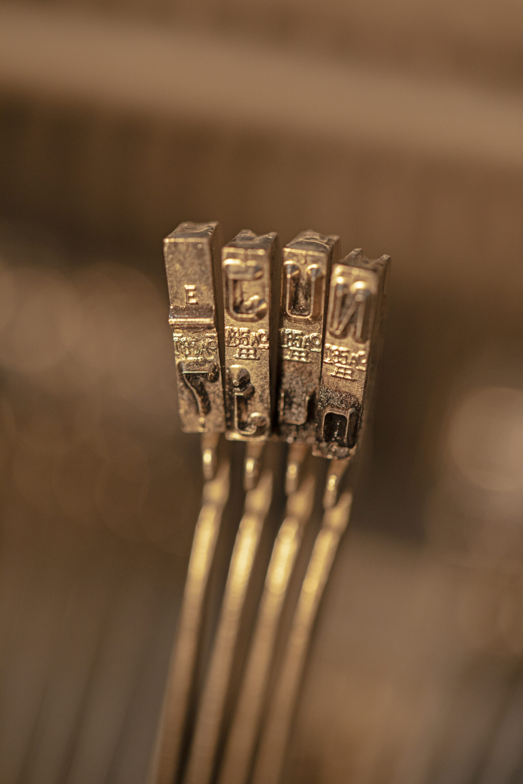 defocused-metallic-typesetting-letters
